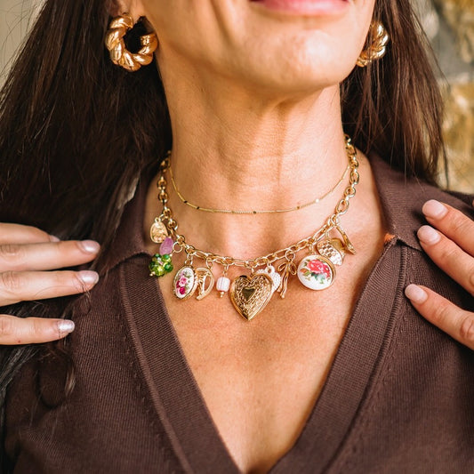 charm necklace, gold charm necklace, statement necklace, vintage-inspired jewelry, eclectic charm jewelry, pastel charm necklace, floral charm necklace, heart locket necklace, bow charm necklace, seashell charm necklace, trendy gold necklace, boho chic jewelry, boutique statement necklace, layered gold chain, adjustable chain necklace, feminine jewelry, gift for her, trendy boutique accessories, vintage charm necklace, handmade charm jewelry, whimsical necklace, everyday statement jewelry, romantic jewelry 