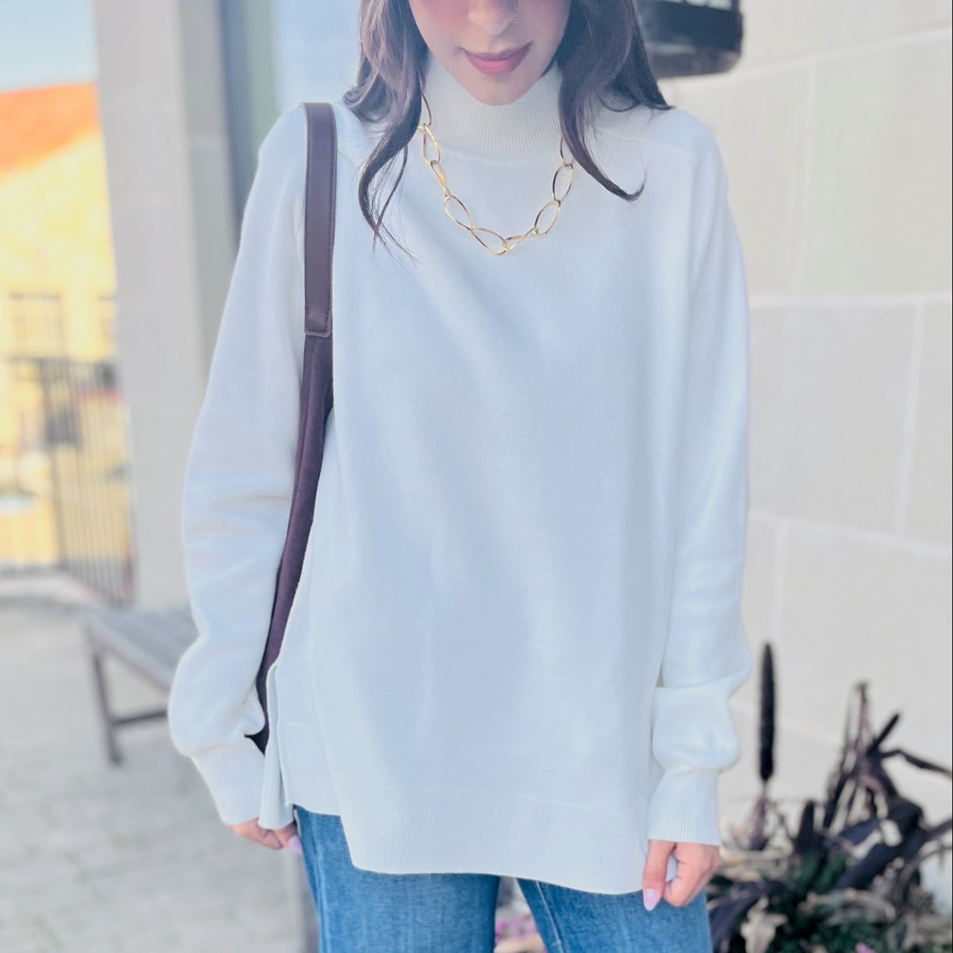 ivory mock neck sweater, cream knit sweater, boutique fall sweater, cozy neutral sweater, side slit pullover, classic ivory sweater, chic winter sweater, timeless cream sweater, soft viscose knit, mock neck cream pullover, neutral capsule wardrobe piece, elevated basics for women, trendy boutique sweater, layering sweater for fall, ivory ribbed knit top, versatile winter outfit, neutral sweater outfit, cozy cream sweater women, dressy casual sweater, knitwear for layering, minimalist winter fashion, boutiqu