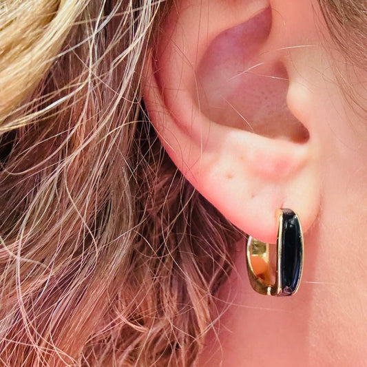 glossy black enamel earrings, black and gold hoop earrings, minimalist hoop earrings, modern black enamel jewelry, small everyday hoops, polished gold hoop earrings, sleek contrast earrings, lightweight hoop earrings, refined statement hoops, versatile everyday jewelry, black accent hoop earrings, gold metal hoop accessories, trendy small hoops for women, compact hoop earrings, enamel inlay earrings
