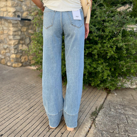 high rise wide leg jeans, A-line denim, raw hem jeans, wide leg denim pants, high waist jeans, comfortable stretch jeans, boutique denim, women’s wide leg jeans, casual chic denim, versatile denim pants, everyday denim, trendy high rise jeans, flowy wide leg jeans, stylish wide leg trousers, vintage inspired jeans, polished casual denim, fashion forward denim, leg-lengthening jeans, high waist A-line jeans, raw edge denim, relaxed fit denim, wide leg outfit, denim essentials for women, modern boutique jeans