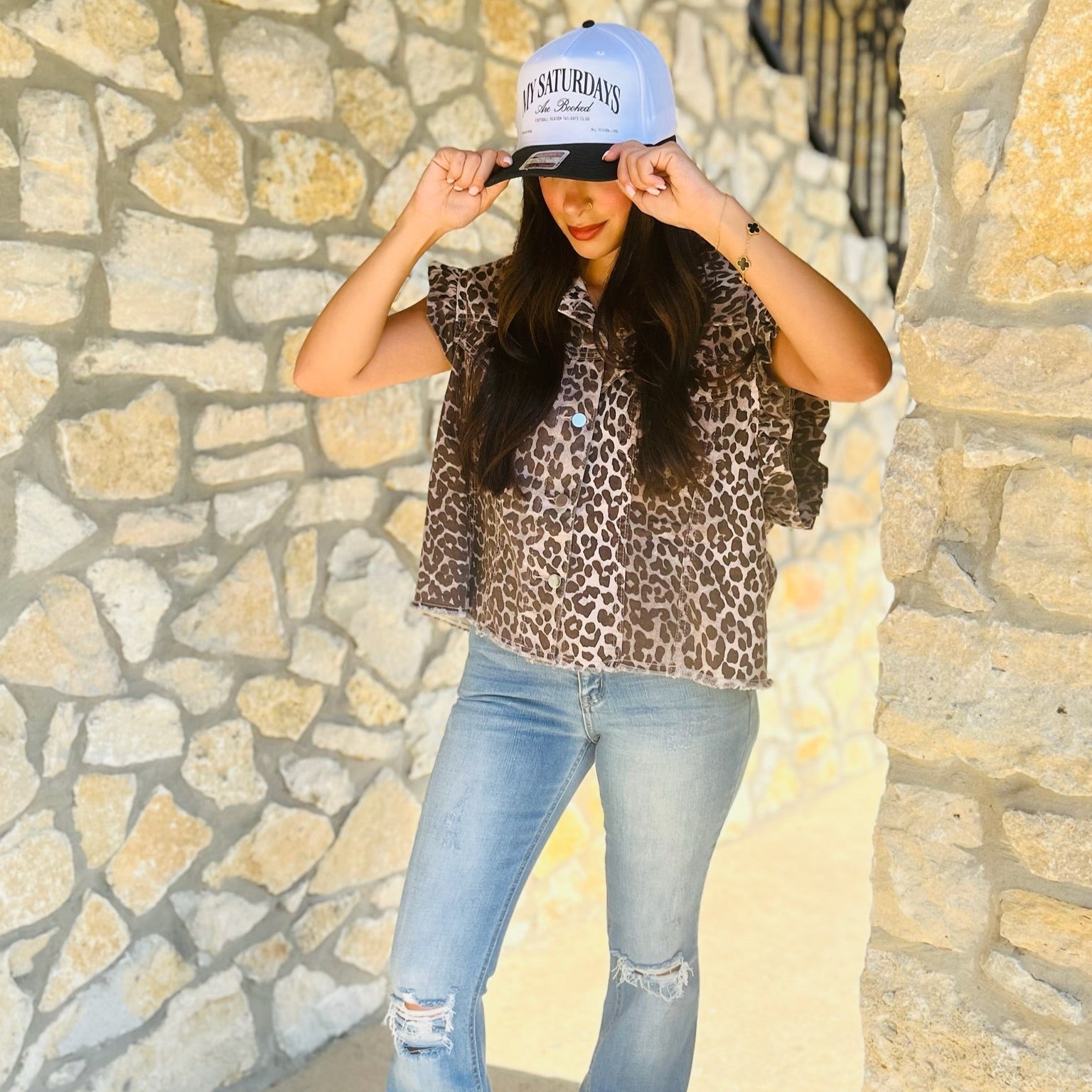 leopard denim vest, animal print vest, ruffle sleeve denim vest, frayed hem vest, bold leopard print top, statement denim vest, trendy fall layering piece, edgy leopard vest, sleeveless denim jacket, button front vest, collared denim vest, game day outfit, concert outfit vest, stylish casual vest, breathable denim top, soft cotton blend vest, fashion forward leopard vest, versatile layering piece, chic animal print top, standout denim vest