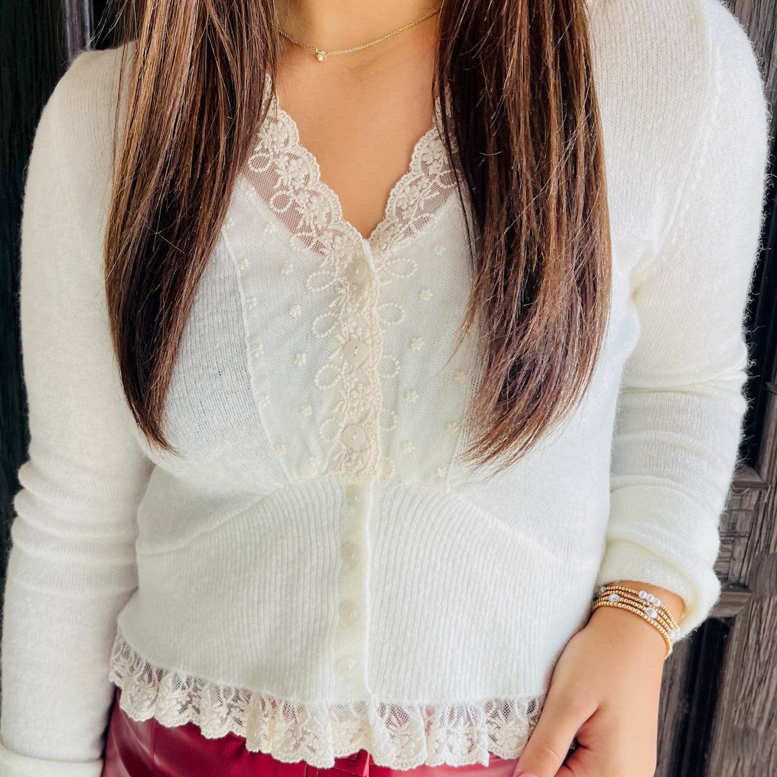 cream knit top, lace contrast top, button down cardigan, feminine sweater top, ruffle hem top, V neck knit top, cream lace cardigan, flirty knit blouse, romantic sweater, cozy chic top, boutique knitwear, girly lace top, soft neutral sweater, brunch outfit top, coffee date outfit, fall layering piece, sweet feminine style, long sleeve knit top, trendy boutique top