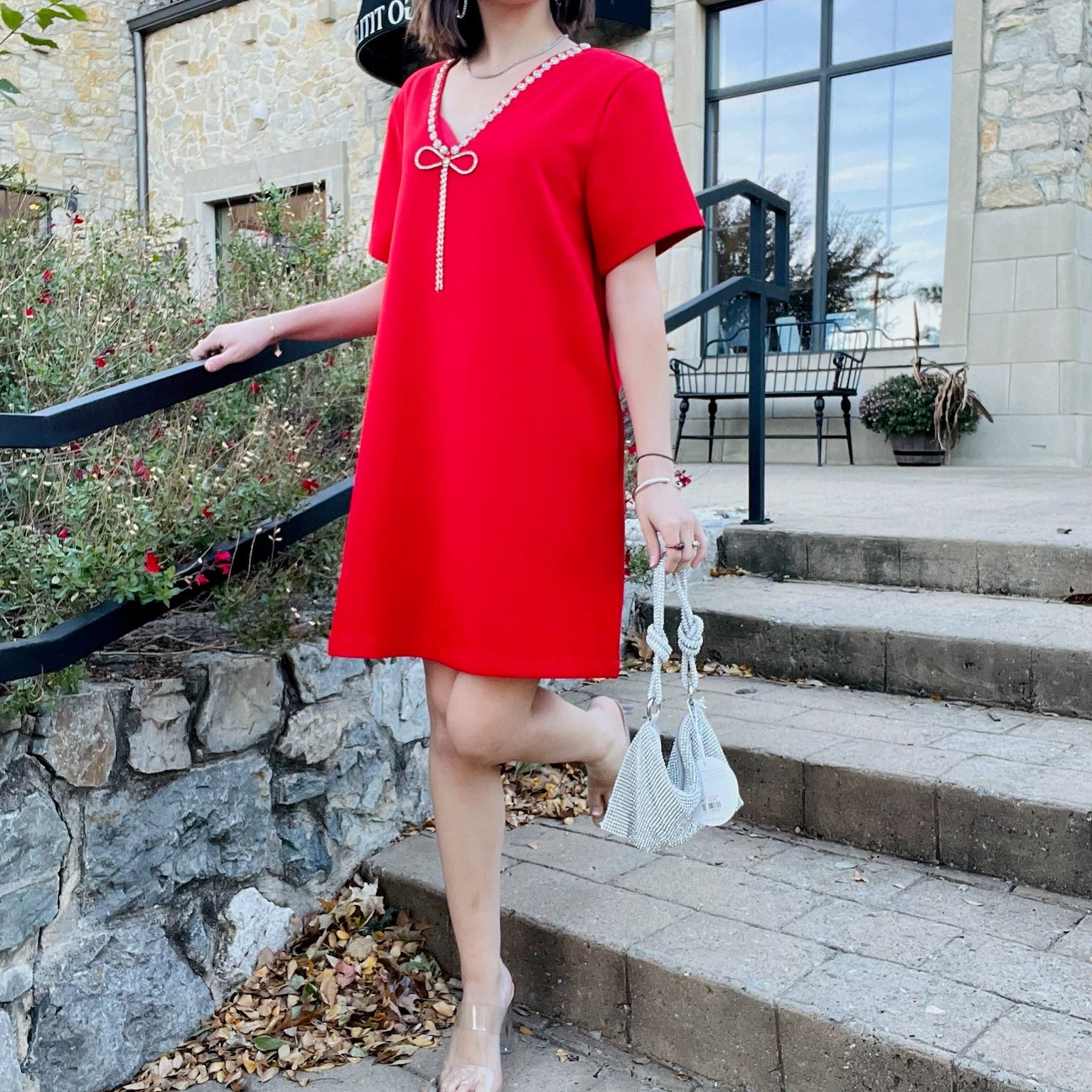 stazie dress, red mini dress, rhinestone bow dress, v neck party dress, short sleeve cocktail dress, holiday outfit, christmas party dress, red shift dress, sparkly neckline dress, statement mini dress, rhinestone trim dress, flirty red dress, boutique holiday dress, night out dress, date night outfit, festive red mini, glam party look, elegant short dress, solid red mini, special occasion outfit, chic red cocktail dress, timeless red dress, sparkly bow detail dress, classy holiday attire