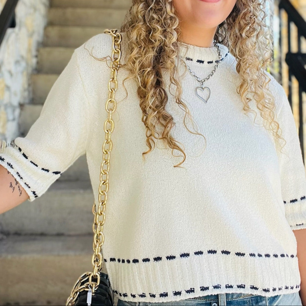 stitch detail top, knit short sleeve top, white and navy top, textured knit blouse, crew neck knit top, classic short sleeve sweater, casual chic top, office knit top, brunch outfit top, everyday knit blouse, lightweight sweater top, navy trim top, polished casual top, versatile white top, feminine knit shirt, stylish textured top, soft acrylic knit top, minimal knit blouse, timeless short sleeve top, effortless everyday top