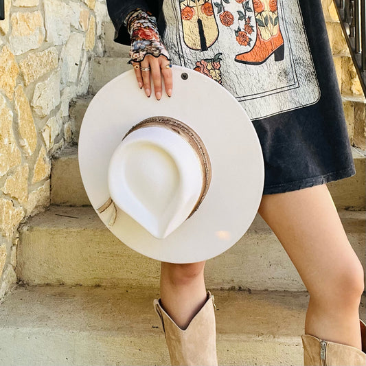 white wool felt hat, western chic hat, fall winter hat, concert outfit accessory, rodeo style hat, women’s cowboy hat, wide brim felt hat, white statement hat, boho western fashion, dressy felt hat, elasta-fit comfort band, solid white hat, wool hat with band, trendy fall accessory, cozy winter outfit hat, classic western style hat, flowy dress and boots outfit, versatile wool felt hat, all-day wear hat, chic white brim hat