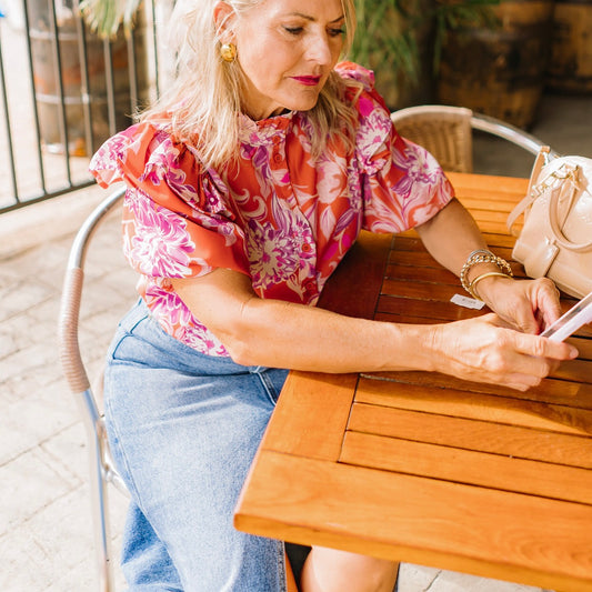 ruffle print top, multicolor blouse, feminine printed top, high neck blouse, button down ruffle top, woven short sleeve top, colorful patterned blouse, timeless printed blouse, chic ruffle sleeve top, classic feminine top, vibrant print blouse, summer to fall top, dressy casual blouse, statement print top, lightweight woven blouse, stylish multicolor top, trendy ruffle blouse, polished printed top, playful pattern blouse, versatile dressy top