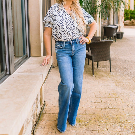 mid rise jeans, wide leg jeans, full length denim, comfort stretch jeans, relaxed fit jeans, slightly distressed denim, women’s wide leg pants, boutique denim, flattering mid rise jeans, long inseam jeans, 34 inch inseam jeans, versatile blue jeans, casual chic denim, everyday wide leg jeans, trendy fall denim, effortless jeans for women, polished wide leg silhouette, elevated basics denim, Sweet Voyage jeans, T6613 jeans, comfortable women’s jeans, classic blue denim, modern wide leg trousers