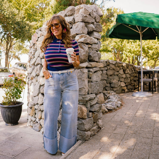 navy striped polo sweater, striped knit polo, short sleeve polo sweater, collared knit top, button down striped sweater, fall polo sweater, preppy striped sweater, transitional fall knit, soft knit polo top, lightweight wool sweater, game day sweater, casual striped top, classic navy sweater, short sleeve collared sweater, navy button sweater, polo style knitwear, chic fall layering piece, cropped look polo sweater, not cropped polo top, timeless striped sweater, wool blend polo sweater