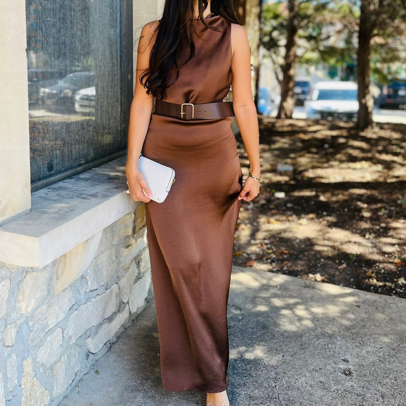 brown satin dress, dark brown maxi dress, fall wedding guest dress, elegant satin gown, belted maxi dress, sleeveless brown dress, high neck formal dress, flowy satin dress, long brown dress, fall formal outfit, holiday party dress, wedding guest outfit, satin evening dress, chic brown dress, dressy fall outfit, boutique maxi dress, satin belted gown, brown occasion dress, sophisticated satin look, fall event outfit, trendy brown maxi, sleeveless formal gown, fall to winter dress, satin holiday style