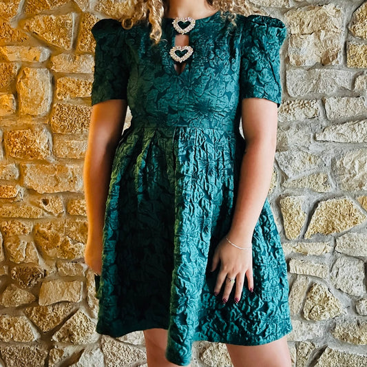holiday party dress, emerald green mini dress, jewel tone dress, Christmas dress, festive dress, winter event outfit, jacquard puff sleeve dress, rhinestone trim dress, flattering holiday dress, Nutcracker outfit, holiday work party look, pleated skirt mini dress, thick material dress, emerald jacquard mini, chic holiday fashion, fur coat outfit idea, statement holiday style, boutique Christmas outfit, elegant holiday dress, mckinney texas dresses, boutique dresses, shop local