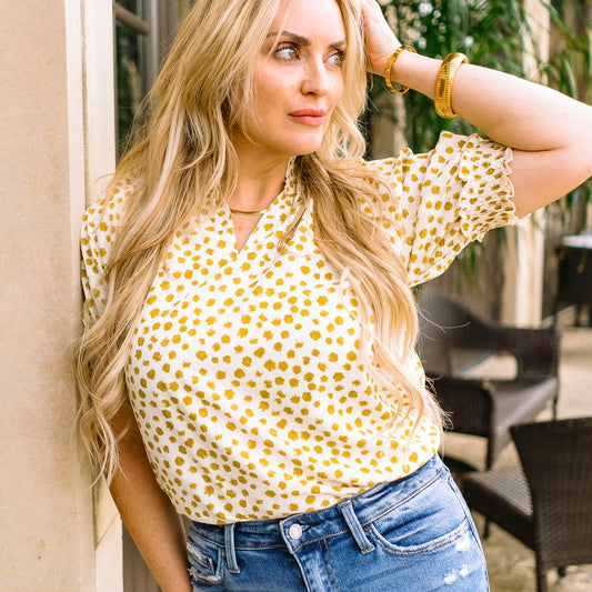 dot print blouse, jacquard dot top, puff sleeve blouse, smocked neckline top, lightweight women's blouse, business casual top, office outfit blouse, chic everyday top, V-neck blouse, feminine blouse for work, weekend brunch top, boutique women's top, casual yet polished top, versatile blouse for women, stylish dot print top, trendy puff sleeve top, smocked cuff blouse, sophisticated workwear top, soft breathable blouse, timeless women’s top, elegant dot blouse, neutral printed blouse, office to weekend top,