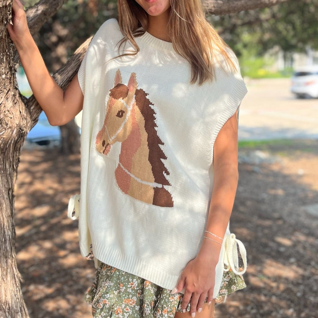horse graphic sweater, western sweater top, oversized knit top, sleeveless sweater, tie detail sweater, side slit top, casual western sweater, lightweight knit top, acrylic sweater for women, boutique western fashion, horse lover top, trendy graphic sweater, chic oversized sweater, versatile summer knit, layered sweater top, western inspired clothing, statement knit top, stylish sleeveless sweater, casual boutique top, western chic sweater, fun graphic top, unique horse sweater, fall layering sweater