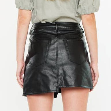 leather mini skirt, PU leather skirt, faux leather mini, edgy mini skirt, rocker style skirt, holiday party skirt, winter fashion skirt, fall fashion skirt, statement mini skirt, lined leather skirt, high waist mini skirt, zipper closure skirt, pocketed mini skirt, belt loop skirt, chic leather skirt, off-duty model outfit, edgy holiday outfit, tall boots outfit, sleek booties outfit, versatile mini skirt