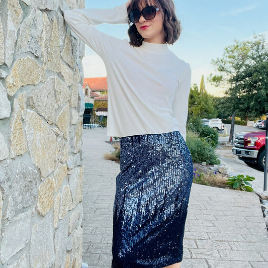 blue sequin ombre midi skirt, navy and silver sequin skirt, sequin party skirt, holiday party outfit, sparkly ombre skirt, festive boutique skirt, statement sequin midi skirt, shimmer and shine outfit, elegant evening skirt, glamorous holiday look, new year’s eve party outfit, cocktail party skirt, boutique holiday fashion, navy sequin skirt with slit, ombre sparkle midi skirt, silver to navy sequin fade skirt, dressy winter skirt, chic sequin outfit for women