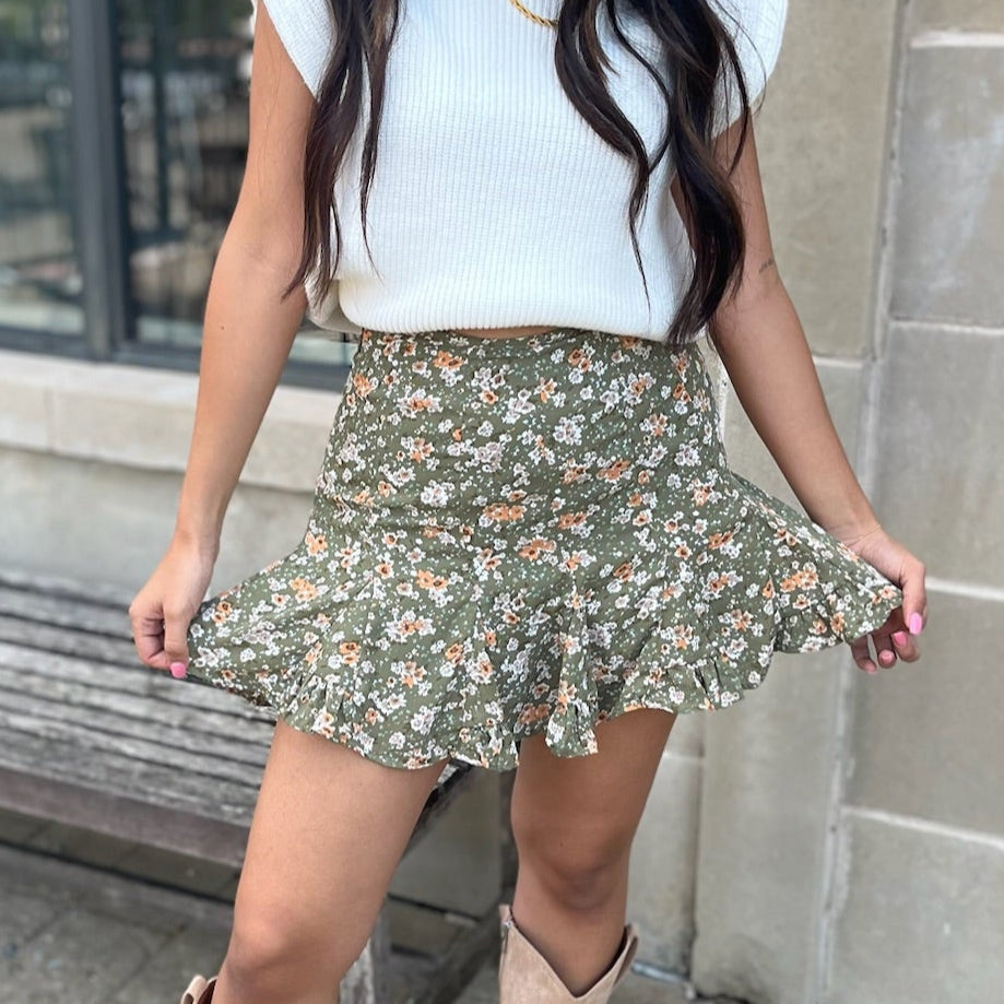 olive floral skort, high waisted skort, mini skort, built-in shorts skirt, floral print skort, women’s summer skort, boutique skort, flirty mini skirt, vacation outfit skort, casual chic skort, layered skort, lined skort, versatile skort for women, warm weather skirt, dinner outfit skort, family photo outfit, trendy summer skirt, feminine skirt with shorts, easy-to-wear skort, olive green skort, stylish summer bottom, lightweight skort, flirty floral skort, effortless summer style