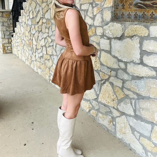 camel suede romper, flared romper, boatneck romper, button detail romper, sleeveless suede romper, fall statement outfit, boutique romper, autumn fashion piece, chic fall romper, cozy stylish romper, camel colored romper, trendy romper for women, layered jewelry outfit, fall photo shoot outfit, casual chic romper, game day outfit romper, concert outfit romper, versatile autumn romper, suede romper for fall, boutique women’s fashion, elegant fall romper, stylish day to night romper, camel flared romper