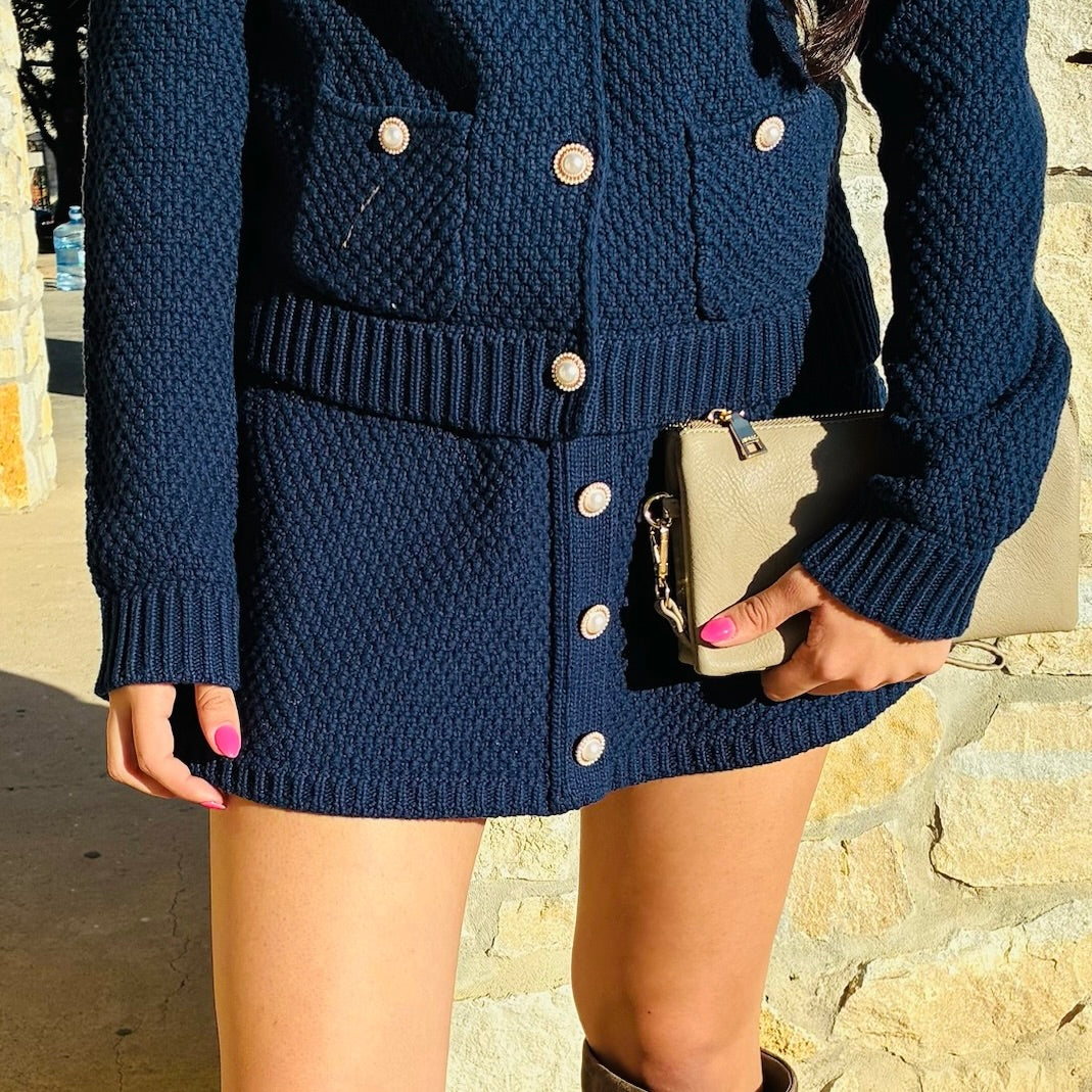 pearl button skirt, matching knit skirt, textured knit skirt women, cotton knit skirt, ivory knit skirt, navy knit skirt, button front skirt women, pearl detail skirt, elevated everyday skirt, polished knit skirt, feminine wardrobe staple, classic silhouette skirt, ribbed waist knit skirt, dressy casual skirt women, fall to spring skirt, boutique women’s skirts, coordinated set skirt, skirt and cardigan set, refined knitwear women