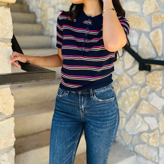 navy striped polo sweater, striped knit polo, short sleeve polo sweater, collared knit top, button down striped sweater, fall polo sweater, preppy striped sweater, transitional fall knit, soft knit polo top, lightweight wool sweater, game day sweater, casual striped top, classic navy sweater, short sleeve collared sweater, navy button sweater, polo style knitwear, chic fall layering piece, cropped look polo sweater, not cropped polo top, timeless striped sweater, wool blend polo sweater