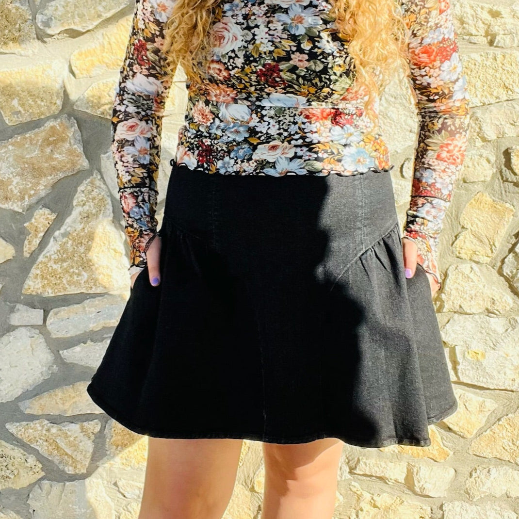 black flare mini skirt, black denim mini skirt, flared mini skirt, stretchy mini skirt, black skirt for all seasons, versatile mini skirt, year-round skirt, fall mini skirt, winter mini skirt, spring mini skirt, summer mini skirt, mini skirt with back zipper, casual black skirt, dressy black mini skirt, comfortable denim skirt, black skirt with stretch, soft denim mini skirt, high waist mini skirt, game day skirt, transitional mini skirt, wardrobe staple skirt, everyday black skirt, flattering mini skirt