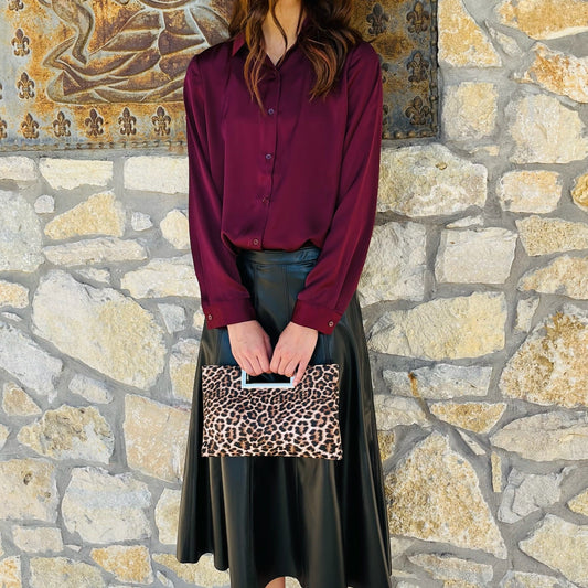 black faux leather skirt, vegan leather skirt, pleather midi skirt, flared leather skirt, black midi skirt, side zip skirt, chic black skirt, fall fashion outfit, edgy leather skirt, versatile skirt, boutique midi skirt, trendy faux leather skirt, vegan leather fashion, statement skirt, dressy black skirt, women’s midi skirt, street style outfit, fall outfit idea, night out skirt