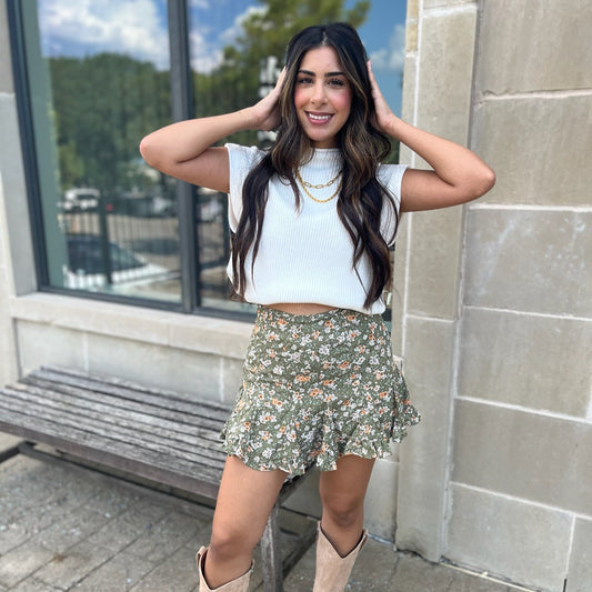 olive floral skort, high waisted skort, mini skort, built-in shorts skirt, floral print skort, women’s summer skort, boutique skort, flirty mini skirt, vacation outfit skort, casual chic skort, layered skort, lined skort, versatile skort for women, warm weather skirt, dinner outfit skort, family photo outfit, trendy summer skirt, feminine skirt with shorts, easy-to-wear skort, olive green skort, stylish summer bottom, lightweight skort, flirty floral skort, effortless summer style