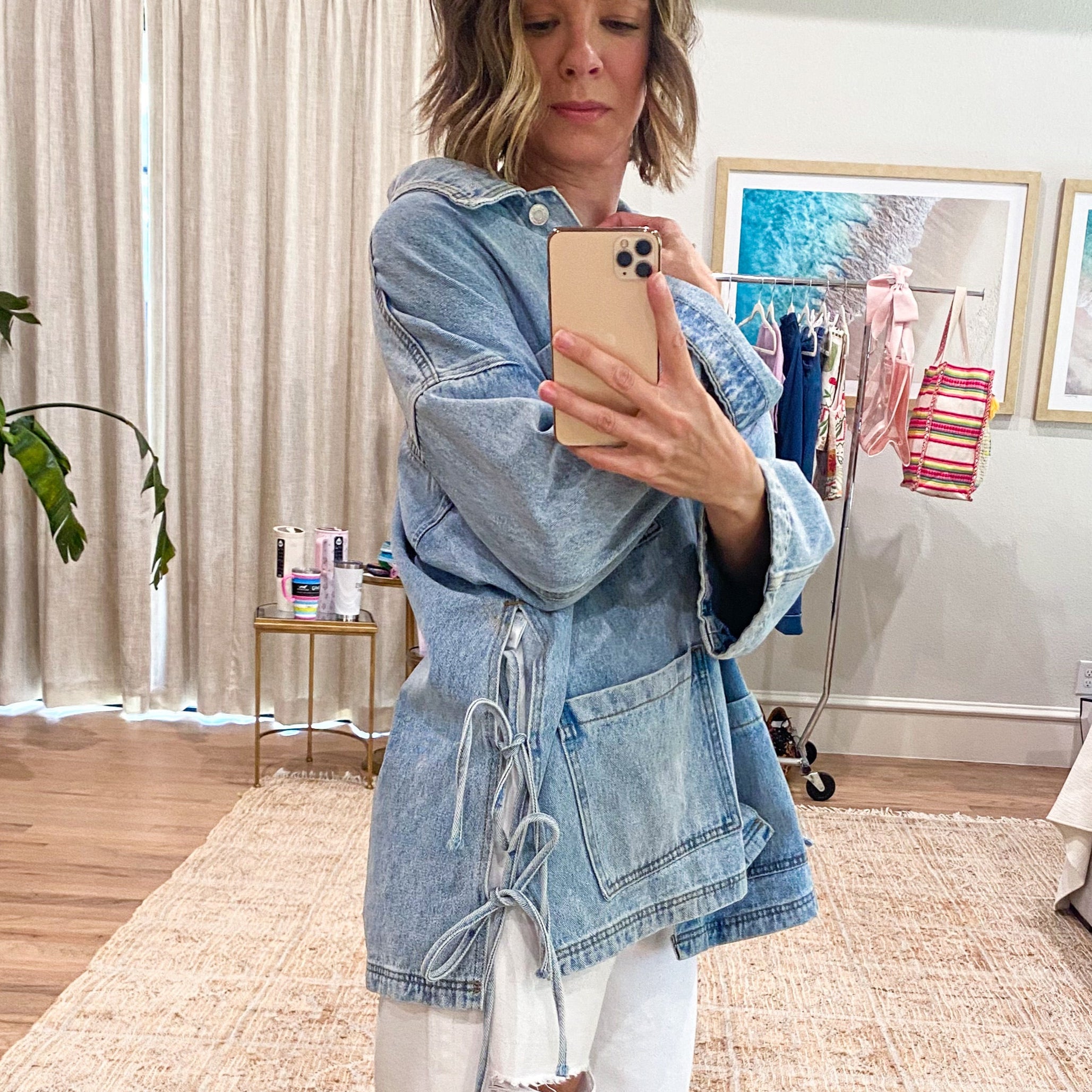 tied up denim jacket, oversized denim jacket, boyfriend fit denim jacket, side tie detail jacket, statement denim jacket, trendy jean jacket, casual oversized jacket, women’s denim outerwear, fall layering piece, front pocket jean jacket, unique denim style, elevated casual outfit, street style denim jacket