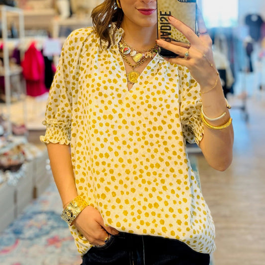dot print blouse, jacquard dot top, puff sleeve blouse, smocked neckline top, lightweight women's blouse, business casual top, office outfit blouse, chic everyday top, V-neck blouse, feminine blouse for work, weekend brunch top, boutique women's top, casual yet polished top, versatile blouse for women, stylish dot print top, trendy puff sleeve top, smocked cuff blouse, sophisticated workwear top, soft breathable blouse, timeless women’s top, elegant dot blouse, neutral printed blouse, office to weekend top,