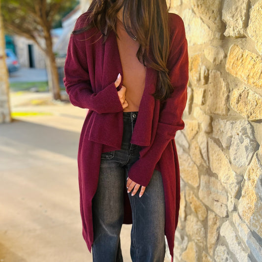 wine lapel cardigan, wine cardigan coat, fall layering jacket, longline cardigan, open front coat, boutique cardigan coat, lightweight fall jacket, structured cardigan, wine outerwear, lapel jacket women, soft layering piece, burgundy cardigan, cozy chic coat, fall fashion staple, dressy cardigan for work, casual layering coat, versatile fall jacket, women’s outerwear boutique, deep red cardigan coat, open front fall coat, trendy fall outfit, long wine coat, transitional fall piece, sophisticated cardigan