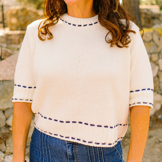 stitch detail top, knit short sleeve top, white and navy top, textured knit blouse, crew neck knit top, classic short sleeve sweater, casual chic top, office knit top, brunch outfit top, everyday knit blouse, lightweight sweater top, navy trim top, polished casual top, versatile white top, feminine knit shirt, stylish textured top, soft acrylic knit top, minimal knit blouse, timeless short sleeve top, effortless everyday top