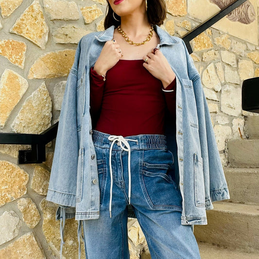 tied up denim jacket, oversized denim jacket, boyfriend fit denim jacket, side tie detail jacket, statement denim jacket, trendy jean jacket, casual oversized jacket, women’s denim outerwear, fall layering piece, front pocket jean jacket, unique denim style, elevated casual outfit, street style denim jacket
