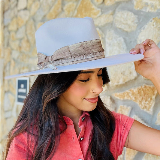 white wool felt hat, western chic hat, fall winter hat, concert outfit accessory, rodeo style hat, women’s cowboy hat, wide brim felt hat, white statement hat, boho western fashion, dressy felt hat, elasta-fit comfort band, solid white hat, wool hat with band, trendy fall accessory, cozy winter outfit hat, classic western style hat, flowy dress and boots outfit, versatile wool felt hat, all-day wear hat, chic white brim hat