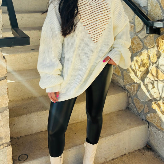 black faux leather leggings, vegan leather leggings, PU coated leggings, shiny black leggings, sleek leggings, form fitting leggings, lightweight faux leather pants, water resistant leggings, edgy black bottoms, trendy leather look leggings, everyday staple leggings, chic date night outfit, boutique leggings, fall fashion essential, versatile black leggings, elevated basics, street style leggings, comfy faux leather pants, women’s black leggings