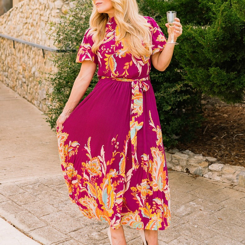 printed midi dress, colorful patterned dress, self-tie waist dress, pleated midi dress, ruffled edge dress, short sleeve midi dress, high neck dress, elegant printed dress, boutique women’s dress, summer wedding dress, brunch outfit dress, garden party dress, vibrant print dress, flattering midi dress, versatile women’s dress, chic day to night dress, statement midi dress, feminine silhouette dress, patterned summer dress, trendy midi dress, stylish printed dress, polished outfit dress, boutique fashion dre
