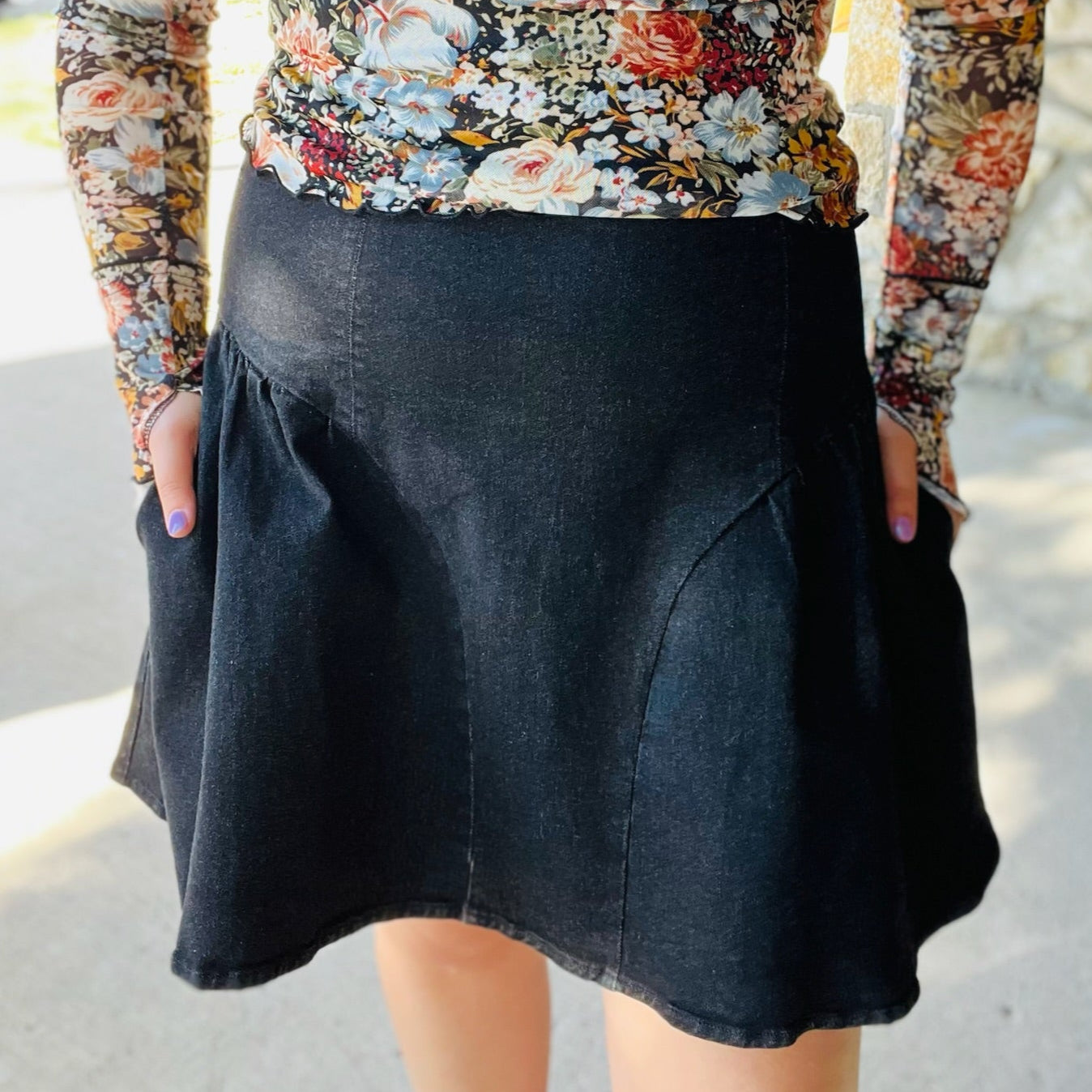 black flare mini skirt, black denim mini skirt, flared mini skirt, stretchy mini skirt, black skirt for all seasons, versatile mini skirt, year-round skirt, fall mini skirt, winter mini skirt, spring mini skirt, summer mini skirt, mini skirt with back zipper, casual black skirt, dressy black mini skirt, comfortable denim skirt, black skirt with stretch, soft denim mini skirt, high waist mini skirt, game day skirt, transitional mini skirt, wardrobe staple skirt, everyday black skirt, flattering mini skirt