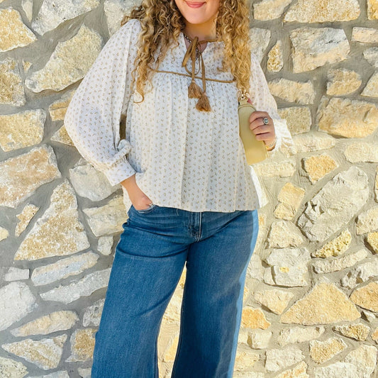 ditsy print blouse, boho floral blouse, linen long sleeve top, tassel tie blouse, feminine boho blouse, boutique fall top, gold trim blouse, lightweight printed blouse, bohemian chic shirt, casual floral top, girly fall outfit, boutique blouse for women, floral peasant top, boho fall fashion, soft linen blouse, fall wardrobe staple, relaxed fit blouse, romantic boho style, everyday floral blouse, country chic outfit, trendy boutique top, versatile fall blouse, tassel neckline blouse, boho-inspired