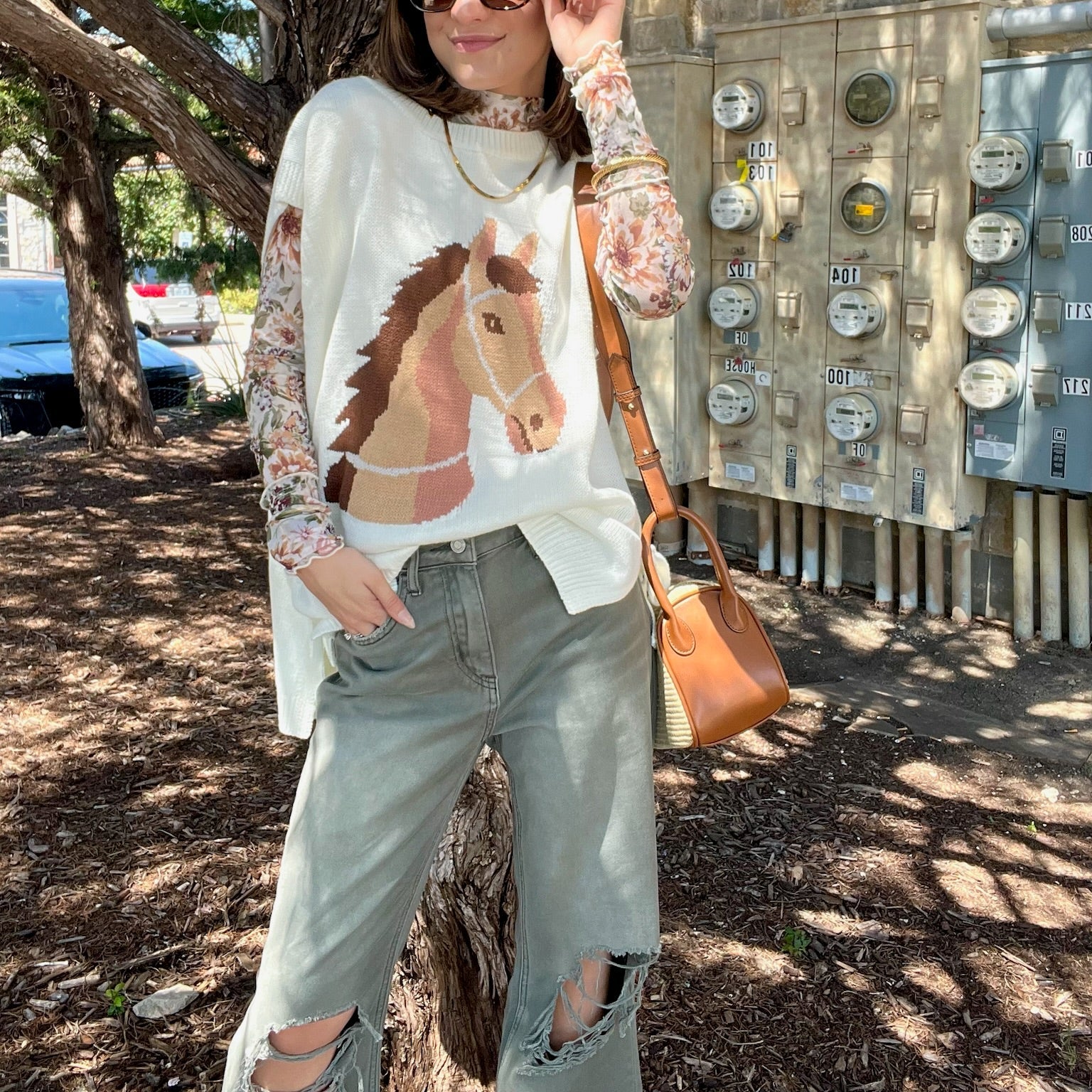 horse graphic sweater, western sweater top, oversized knit top, sleeveless sweater, tie detail sweater, side slit top, casual western sweater, lightweight knit top, acrylic sweater for women, boutique western fashion, horse lover top, trendy graphic sweater, chic oversized sweater, versatile summer knit, layered sweater top, western inspired clothing, statement knit top, stylish sleeveless sweater, casual boutique top, western chic sweater, fun graphic top, unique horse sweater, fall layering sweater