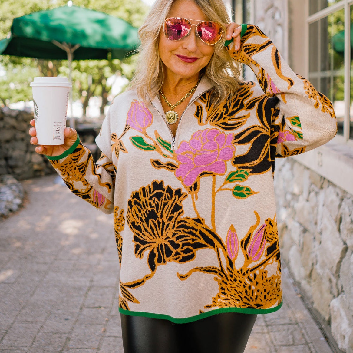 floral pullover sweater, half zip sweater, mock neck sweater, oversized floral sweater, botanical print sweater, fall statement sweater, cozy knit pullover, beige floral sweater, bold pattern sweater, colorful fall sweater, trendy knit top, artistic fall outfit, warm winter sweater, contrast trim sweater, stylish cozy knit, modern floral design sweater, chic fall fashion, relaxed fit sweater, statement knitwear, soft knit pullover