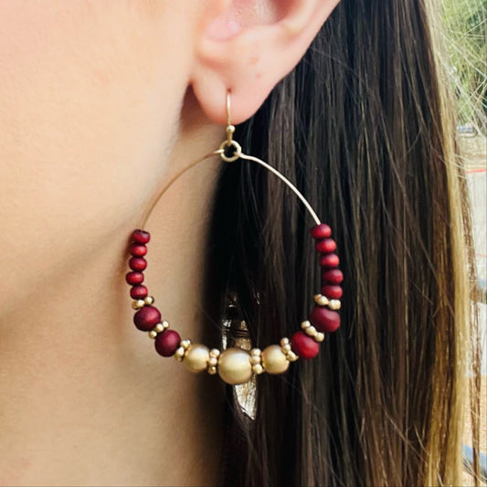 red beaded hoop earrings, gold beaded hoops, western boho earrings, bohemian hoop earrings, lightweight dangle earrings, red and gold jewelry, beaded statement earrings, festival earrings, rodeo style earrings, country chic jewelry, boho fashion accessories, french wire dangle hoops, everyday hoop earrings, trendy western earrings, concert outfit jewelry, casual boho earrings, handmade style earrings, red hoop earrings, gold hoop earrings, unique beaded jewelry