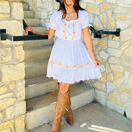 floral embroidered mini dress, peasant style dress, summer floral dress, square neckline mini dress, boho chic dress, flounce hem dress, tassel detail dress, puff sleeve mini dress, red floral dress, off white embroidered dress, casual summer outfit, feminine floral dress, stretchy waist mini dress, lined boho dress