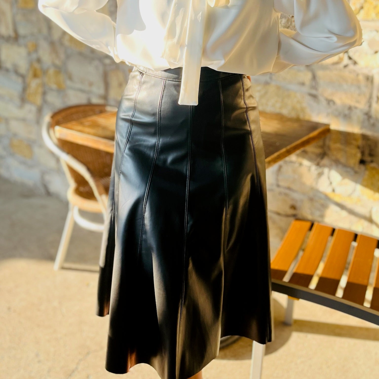 black faux leather skirt, vegan leather skirt, pleather midi skirt, flared leather skirt, black midi skirt, side zip skirt, chic black skirt, fall fashion outfit, edgy leather skirt, versatile skirt, boutique midi skirt, trendy faux leather skirt, vegan leather fashion, statement skirt, dressy black skirt, women’s midi skirt, street style outfit, fall outfit idea, night out skirt