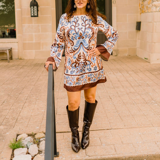 vintage floral dress, bell sleeve mini dress, flowy floral dress, high neck floral dress, retro inspired dress, fall floral dress, earth tone dress, lined mini dress, boutique women’s dress, cozy fall outfit, statement bell sleeves, mini dress with stripes, autumn wardrobe staple, floral print dress, elegant fall dress, chic day to night dress, high boots outfit, tights and dress outfit, boutique fashion dress, versatile fall dress, stylish layered dress, casual chic floral dress, fall weekend outfit, trend