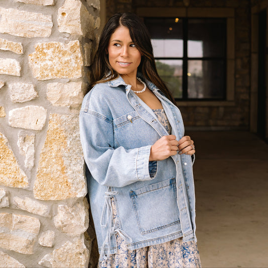 tied up denim jacket, oversized denim jacket, boyfriend fit denim jacket, side tie detail jacket, statement denim jacket, trendy jean jacket, casual oversized jacket, women’s denim outerwear, fall layering piece, front pocket jean jacket, unique denim style, elevated casual outfit, street style denim jacket