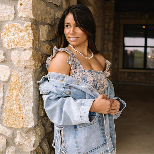 tied up denim jacket, oversized denim jacket, boyfriend fit denim jacket, side tie detail jacket, statement denim jacket, trendy jean jacket, casual oversized jacket, women’s denim outerwear, fall layering piece, front pocket jean jacket, unique denim style, elevated casual outfit, street style denim jacket