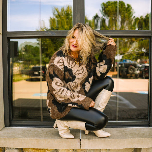 black faux leather leggings, vegan leather leggings, PU coated leggings, shiny black leggings, sleek leggings, form fitting leggings, lightweight faux leather pants, water resistant leggings, edgy black bottoms, trendy leather look leggings, everyday staple leggings, chic date night outfit, boutique leggings, fall fashion essential, versatile black leggings, elevated basics, street style leggings, comfy faux leather pants, women’s black leggings