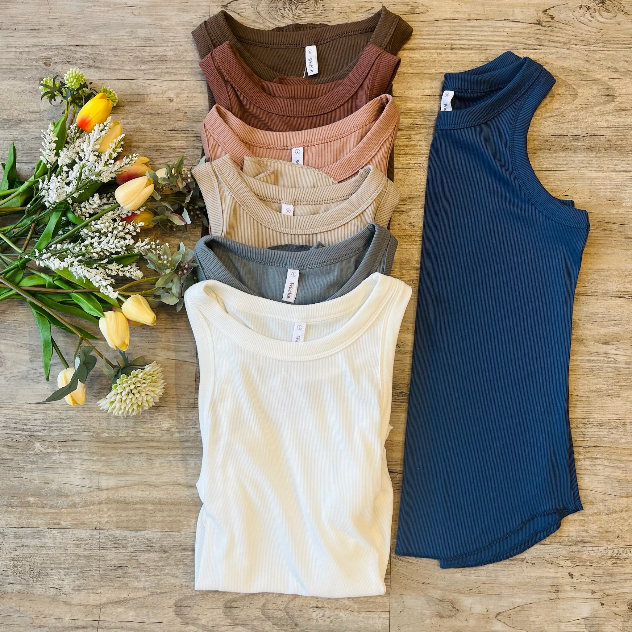 ribbed tank top, fitted tank, sleeveless top, solid color tank, layering tank, athleisure tank, round neck top, stretchy rib knit, casual tank top, everyday wardrobe staple, versatile tank, women’s basic top, rounded hem tank, slim fit tank, workout tank, layering essential, boutique fashion tank