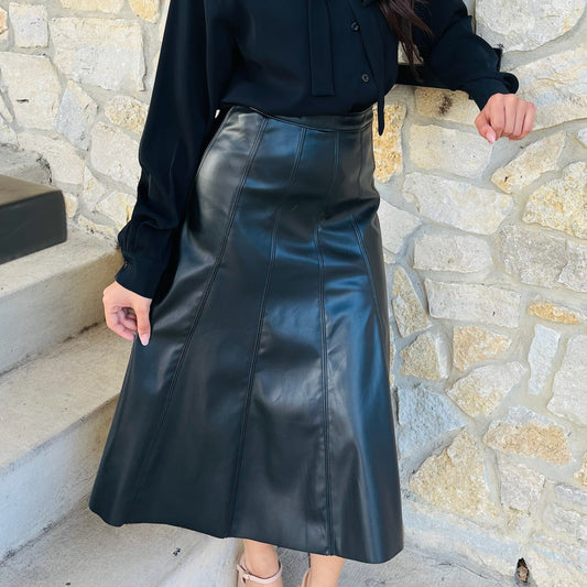 black faux leather skirt, vegan leather skirt, pleather midi skirt, flared leather skirt, black midi skirt, side zip skirt, chic black skirt, fall fashion outfit, edgy leather skirt, versatile skirt, boutique midi skirt, trendy faux leather skirt, vegan leather fashion, statement skirt, dressy black skirt, women’s midi skirt, street style outfit, fall outfit idea, night out skirt