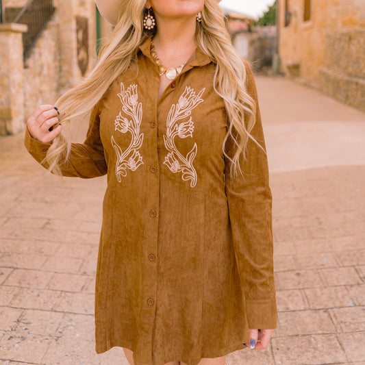 embroidered mini dress, faux suede mini dress, boho mini dress, western chic dress, flared mini dress, collared button down dress, long sleeve mini dress, cuffed sleeve dress, fall festival outfit, game day outfit dress, concert outfit dress, weekend outing dress, olive mini dress, caramel mocha mini dress, boutique fall fashion, trendy boho dress, western-inspired dress, flared silhouette dress, layered jewelry outfit, cowboy boots outfit, holiday gathering dress, fall wardrobe staple