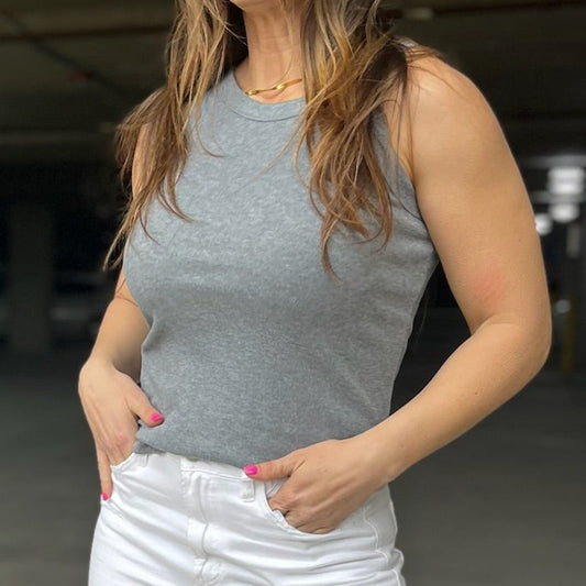 ribbed tank top, fitted tank, sleeveless top, solid color tank, layering tank, athleisure tank, round neck top, stretchy rib knit, casual tank top, everyday wardrobe staple, versatile tank, women’s basic top, rounded hem tank, slim fit tank, workout tank, layering essential, boutique fashion tank