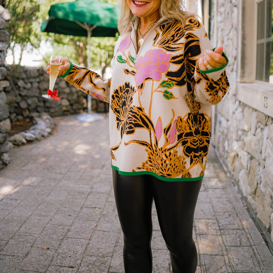 floral pullover sweater, half zip sweater, mock neck sweater, oversized floral sweater, botanical print sweater, fall statement sweater, cozy knit pullover, beige floral sweater, bold pattern sweater, colorful fall sweater, trendy knit top, artistic fall outfit, warm winter sweater, contrast trim sweater, stylish cozy knit, modern floral design sweater, chic fall fashion, relaxed fit sweater, statement knitwear, soft knit pullover