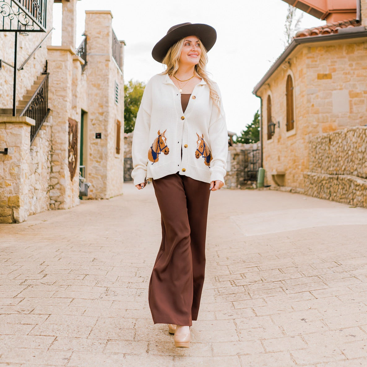 horse cardigan, western-inspired cardigan, graphic knit cardigan, ivory button-down cardigan, cozy fall cardigan, horse print sweater, boutique western fashion, long sleeve knit cardigan, casual chic cardigan, soft knit sweater, fall statement sweater, horse lover gift, rustic chic cardigan, western style sweater, ivory knit cardigan, layering cardigan, trendy fall sweater, women’s western cardigan, boutique fall fashion, unique horse print top, casual fall outfit, chic graphic sweater, autumn wardrobe stap